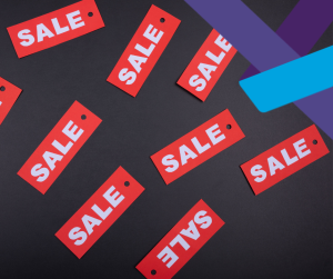 Red "sale" labels on a black background